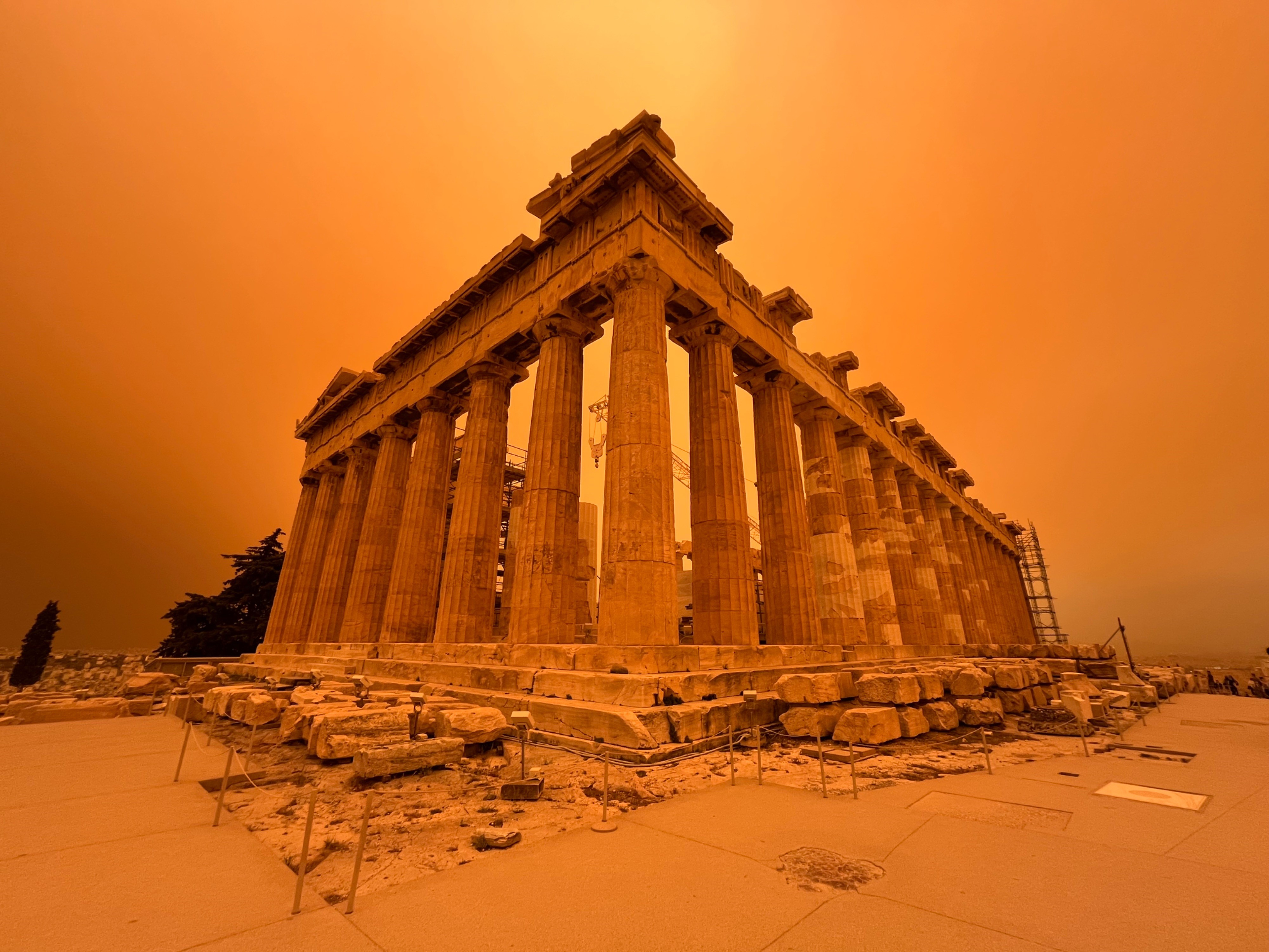 Orange sky because of African Dust over the ancient Greek ruins of Athens