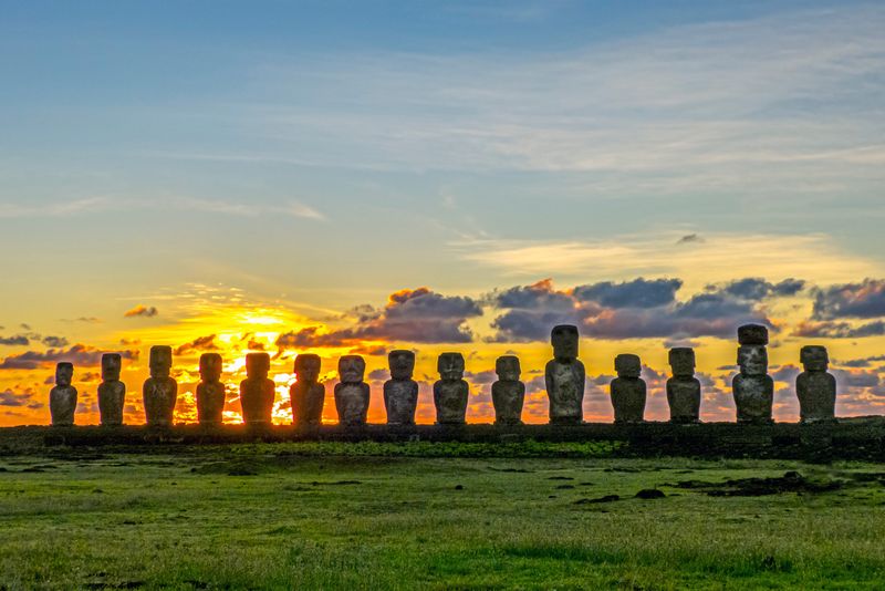 Dawn at Ahu Tongariki, Rapa Nui. New evidence shows they were constructed in between visits to South America, and by a steadily growing population, rather than an unsustainable surge.