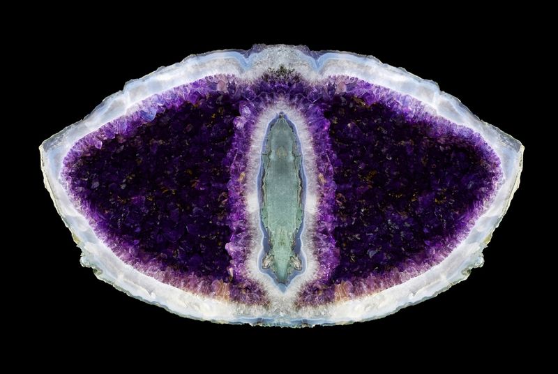 Amethyst geode shows purple crystals.