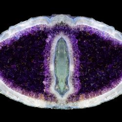 Amethyst geode shows purple crystals.