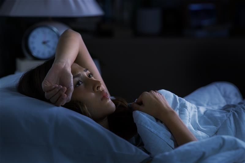 Woman lying awake at 3am