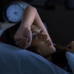 Woman lying awake at 3am