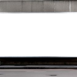 blank whiteboard on a stone wall