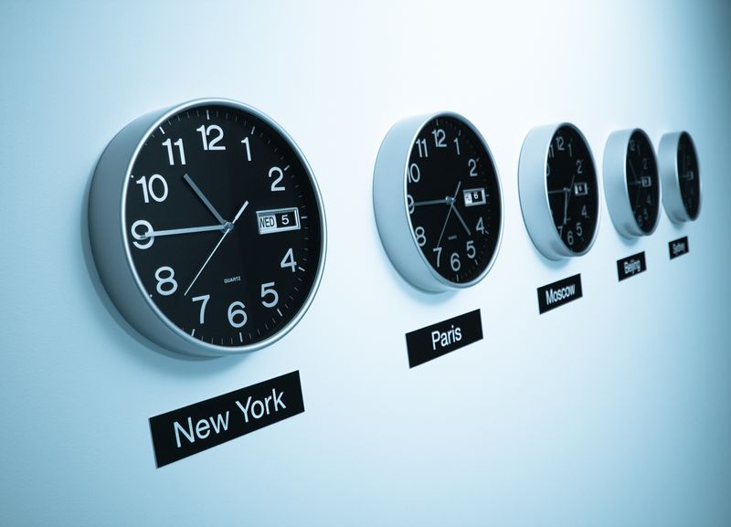 A row of clocks showing the time in different international cities, like New York and Paris.