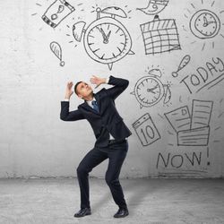 man in business suit being attacked by line drawings of clocks, calendars, paperwork etc