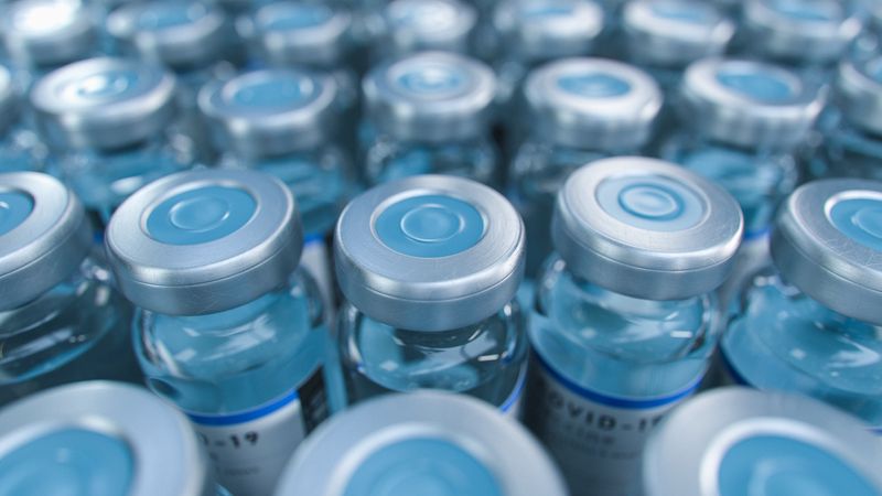 macro of rows of vaccine bottles, photographed from the top