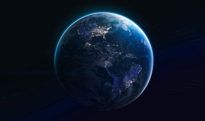 Earth globe showing artificial lights on black background.