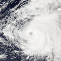 Hurricane Ernesto of the 2024 Atlantic hurricane season approaching Bermuda at its peak intensity during the afternoon of August 16, 2024, as captured by the Moderate Resolution Imaging Spectroradiometer (MODIS) aboard NASA's Aqua satellite.