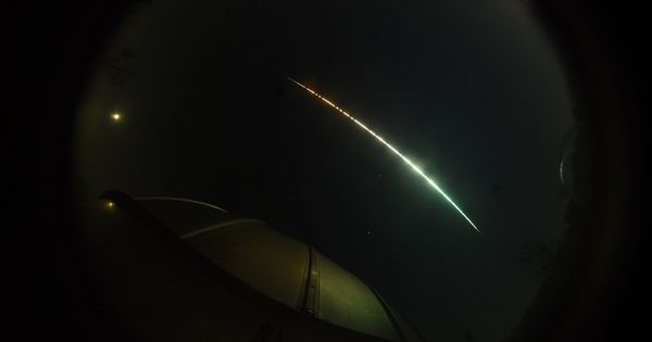 A fish-eye view of the bright streak created by the fireball in the sky