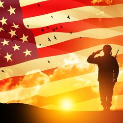 USA army soldier saluting on a background of sunset or sunrise and USA flag. 