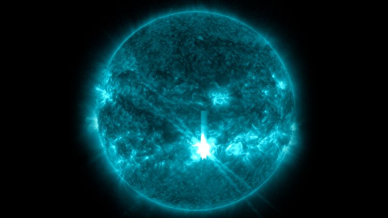 An ultraviolet view of the Sun. In the lower center a bright oversaturared spot of light is visible on the isk. The location of the flare. 