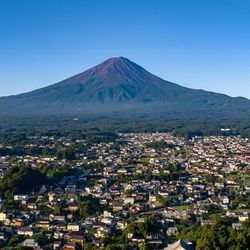 Japan’s iconic Mount Fuji, pictured without snow in summer, overlooks Fujikawaguchiko town.