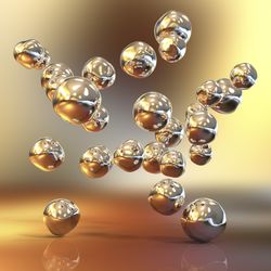 illustrations of spherical gold nanoparticles floating on a background of different shades of gold