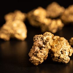 Gold nuggets on black background