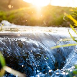 Close up picture of a stream weaving through the hills