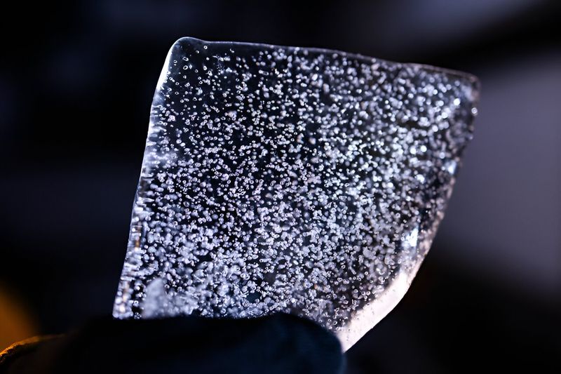 A slice from an Antarctic ice core filled with bubbles.