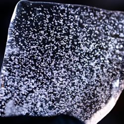 A slice from an Antarctic ice core filled with bubbles.