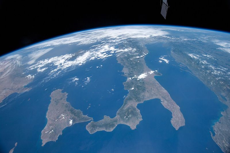 A photograph taken from the International Space Station over Italy, the island of Sicily, and Mediterranean Sea