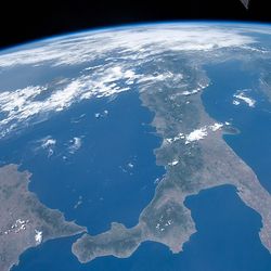 A photograph taken from the International Space Station over Italy, the island of Sicily, and Mediterranean Sea