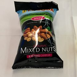 airplane tray table with a bag of mixed nuts and a tumbler of white wine