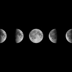 9 images of the moon are visible in the photo from a waxing crescent on the right slowly growing into a full moon in the middle before diminishing back into a crescent, pointing in the other direction