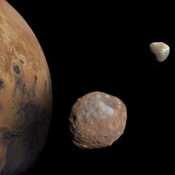 Image of Mars with its moons, Phobos and Deimos