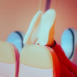 Shoes on a chair in the plane.