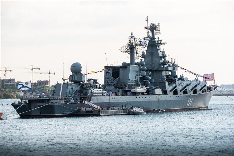 A photo of the Moskva warship in port in 2021. The ship can be seen afloat with flags raised. 