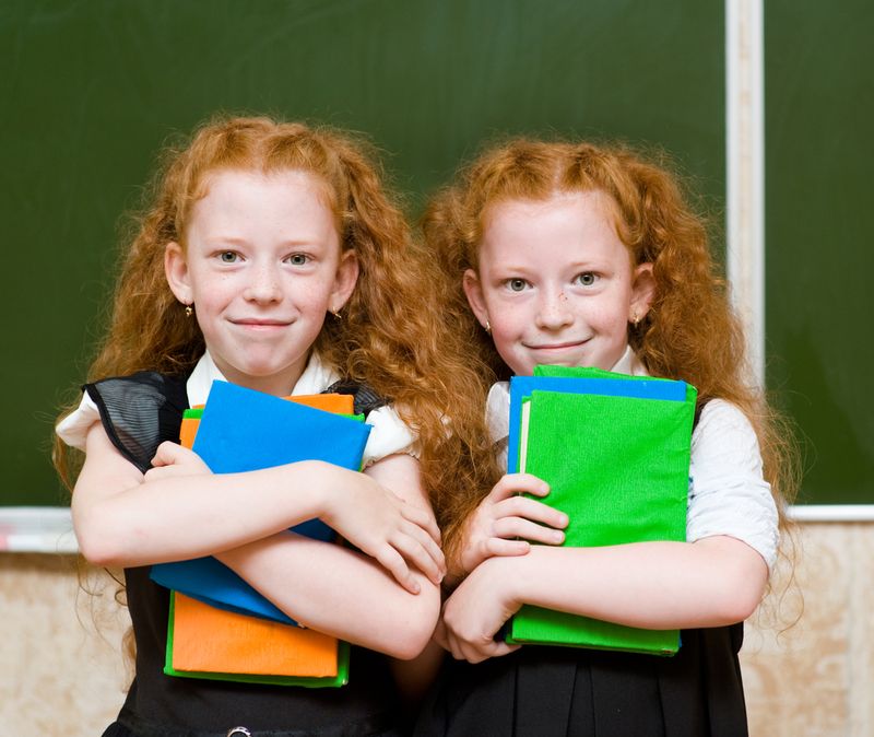 Portrait of twins girls. looking at camera