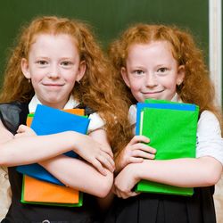 Portrait of twins girls. looking at camera