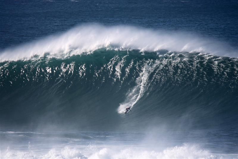 Waves and Surfing at Praia do Norte - Nazaré Portugal.