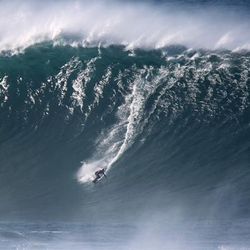 Waves and Surfing at Praia do Norte - Nazaré Portugal.