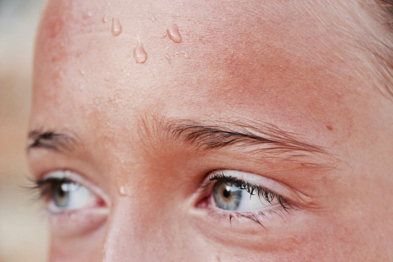 Young girl with sweat on her brow