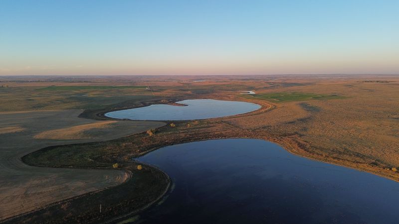 drone photograph of two prairie potholes