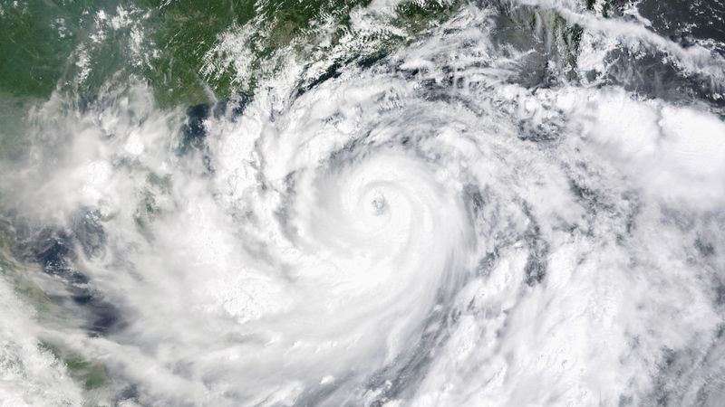 An enormous cyclone take over the whole image. Bits of land to the tope of the image are china.