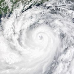 An enormous cyclone take over the whole image. Bits of land to the tope of the image are china.