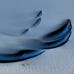 Arc-shaped dark blue markings on an icy background