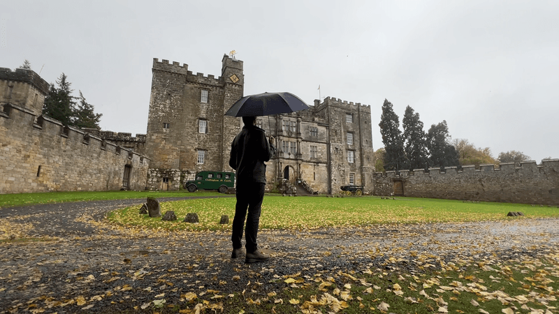 Man standing in front of Chillingham Castle