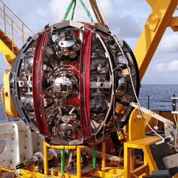 A detector preparing to be lowered into the Mediterranean where it wil capture showers of light created by cosmic rays and neutrinos. Some of these detectors have picked up what is probably the highest energy neutrino ever observed.