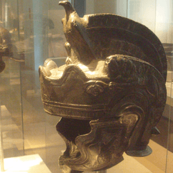 helmets of ancient rome gladiators on display in a museum