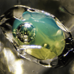 an ancient crystal containing liquid and a bubble