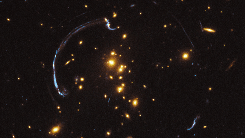 Gravitational lensing of light by galaxies.