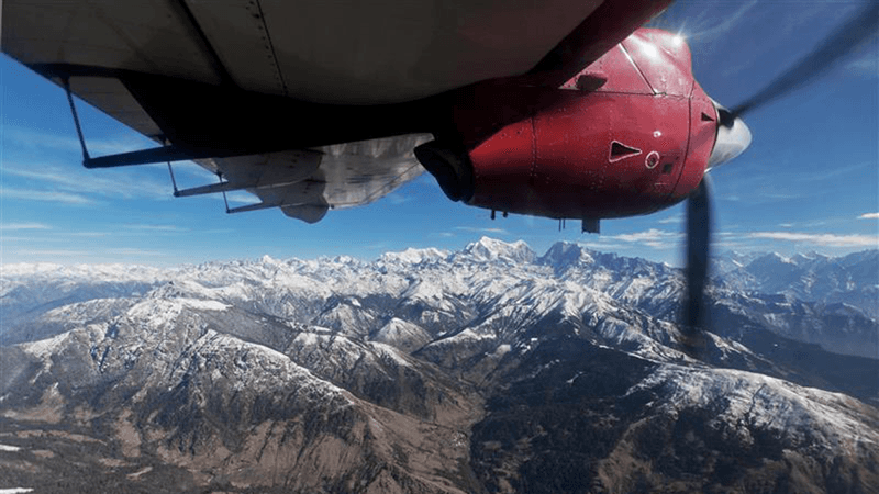 A plane flying near the Himalayas.