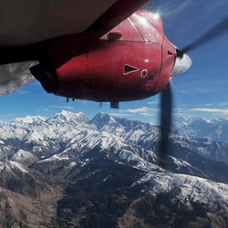 A plane flying near the Himalayas.