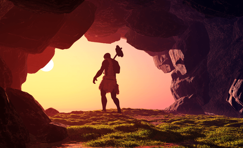 Illustration of an early human leaving a cave into the orange sunset.