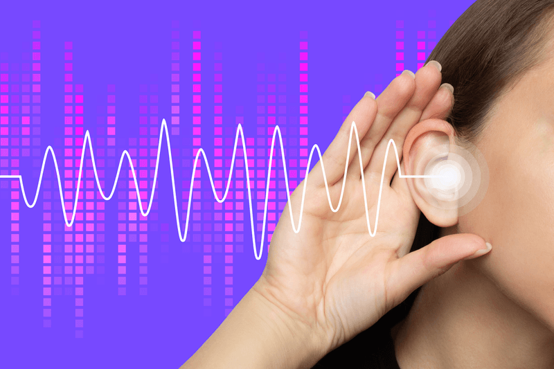 The photo shows the side of a woman's head and her hand cupped around he ear to suggest she is listening to something. There is a white wavy line travelling towards her ear and a patten made of columns of red squares behind it to suggest she is hearing a frequency. The image is set to a purple background.