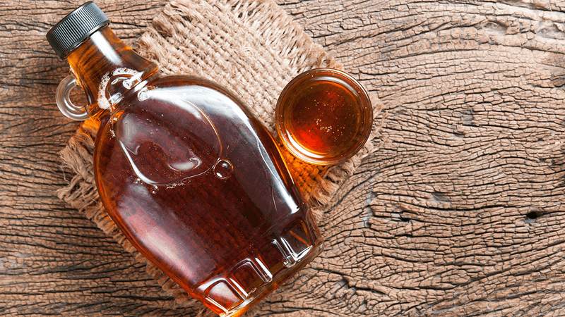 Maple syrup bottle with a tiny little handle.