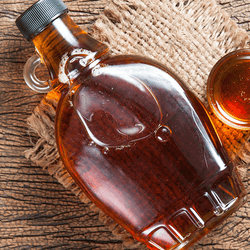 Maple syrup bottle with a tiny little handle.