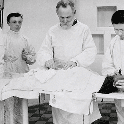 Pavlov operates on a dog, with three lab assistants.