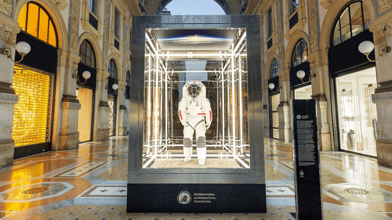 The spacesuit is in a glass box at the center of the turn of the century shopping arcade in Milan